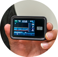 An insulin pump displays information on a patient’s blood sugar levels.